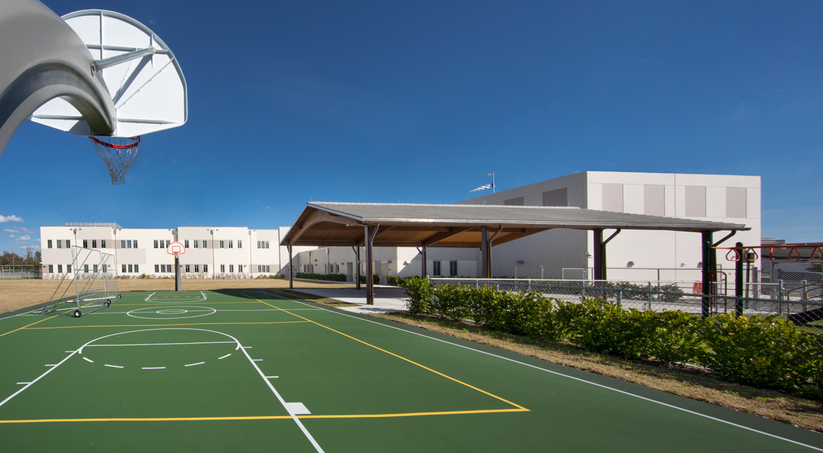 Architectural basketball field view of Andrea Castillo K8 school.